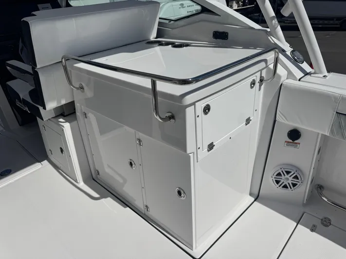  Yacht Photos Pics 2026 Blackfin 272 DC boat interior with sleek white cabinetry and seating.