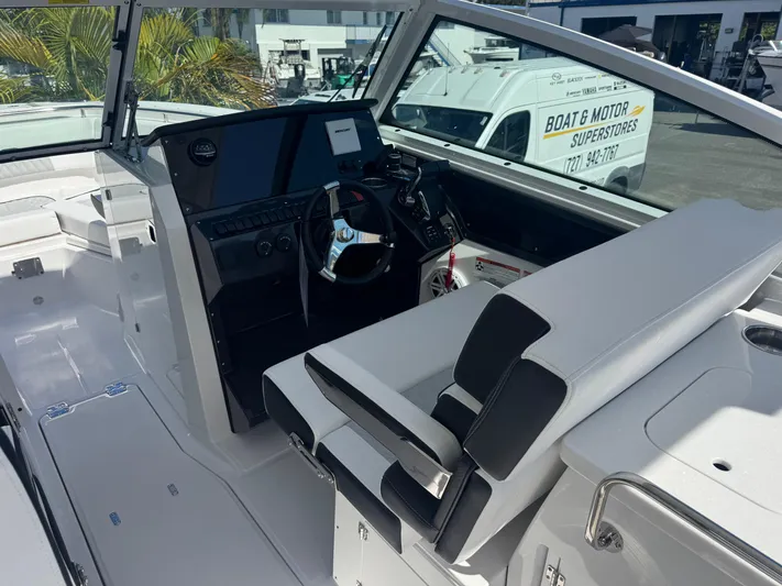  Yacht Photos Pics 2026 Blackfin 272 DC boat interior with modern helm and seating.