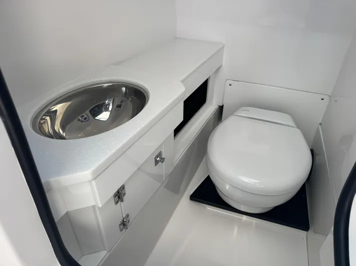  Yacht Photos Pics 2026 Blackfin 272 DC boat bathroom with modern sink and toilet.