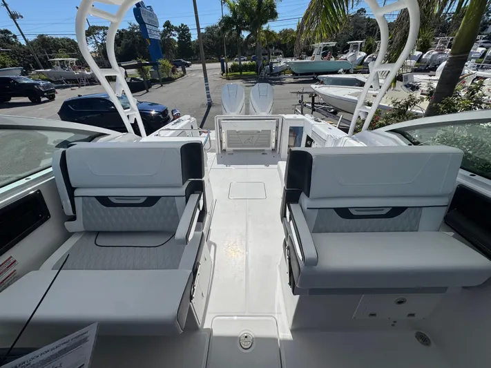  Yacht Photos Pics 2026 Blackfin 272 DC boat interior with seating and deck view.