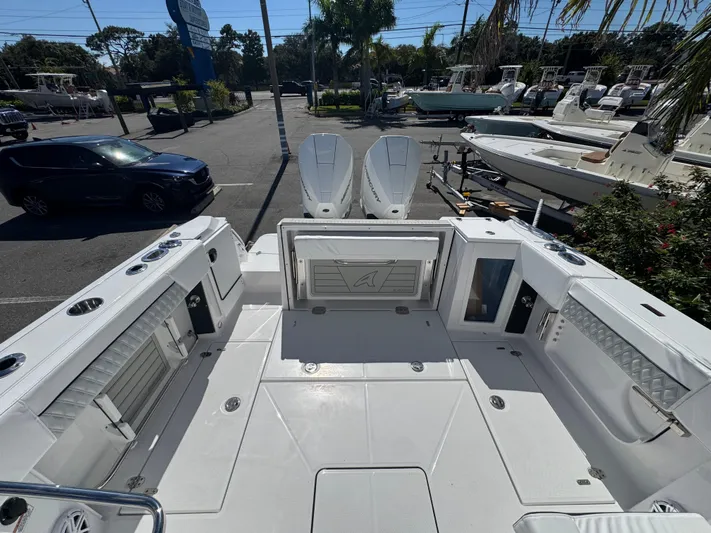  Yacht Photos Pics 2026 Blackfin 272 DC boat interior with spacious deck and modern amenities.