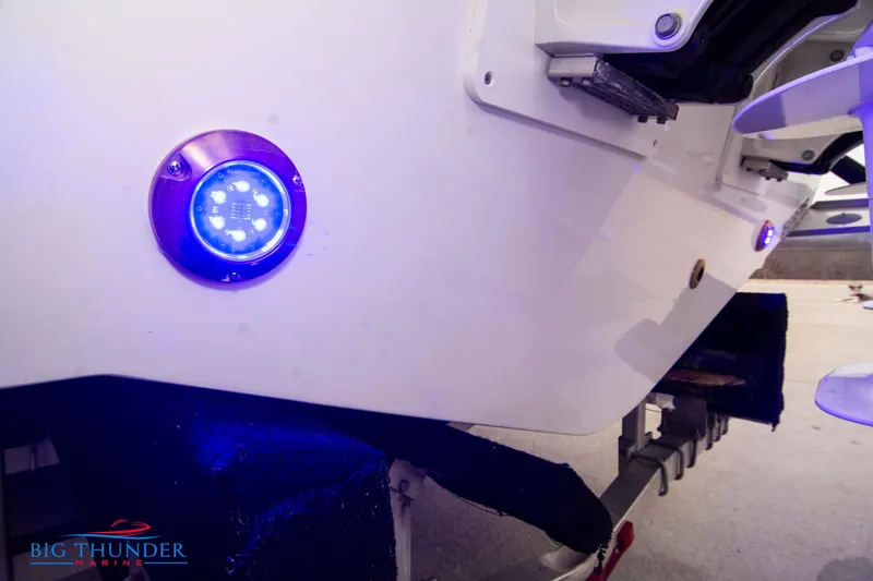  Yacht Photos Pics 2023 Jeanneau Leader 10.5 CC boat with blue LED lights on the hull.