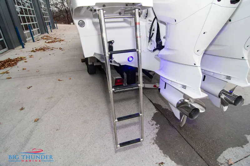  Yacht Photos Pics 2023 Jeanneau Leader 10.5 CC boat ladder and dual outboard motors.