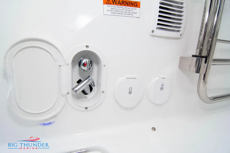  Yacht Photos Pics 2023 Jeanneau Leader 10.5 CC boat controls and warning label detail.