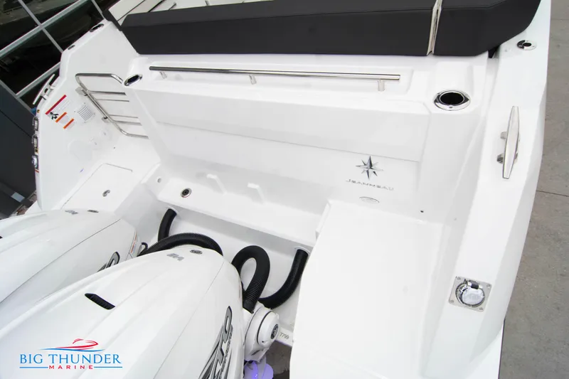  Yacht Photos Pics 2023 Jeanneau Leader 10.5 CC boat stern with dual engines and seating area.