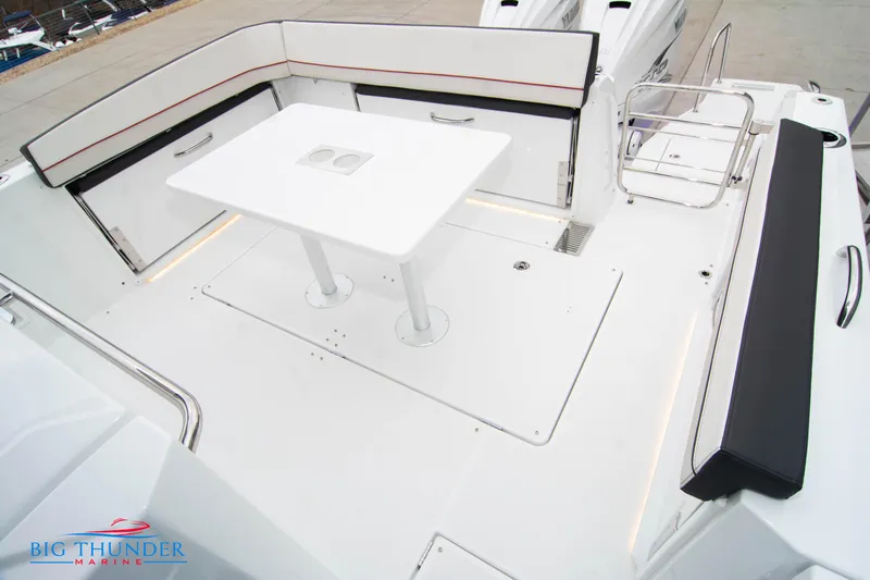  Yacht Photos Pics 2023 Jeanneau Leader 10.5 CC boat deck with seating and table.