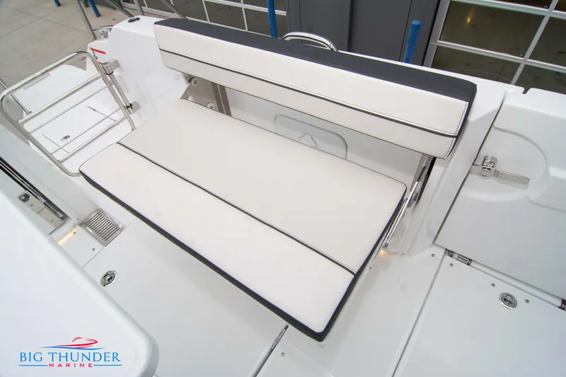  Yacht Photos Pics 2023 Jeanneau Leader 10.5 CC boat seating area with white cushions.