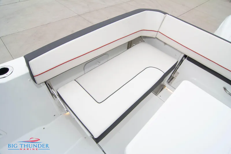  Yacht Photos Pics 2023 Jeanneau Leader 10.5 CC boat seating area with white and gray upholstery.