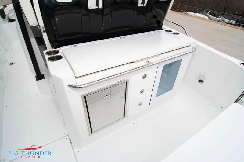 Yacht Photos Pics 2023 Jeanneau Leader 10.5 CC boat interior with storage and sleek design.