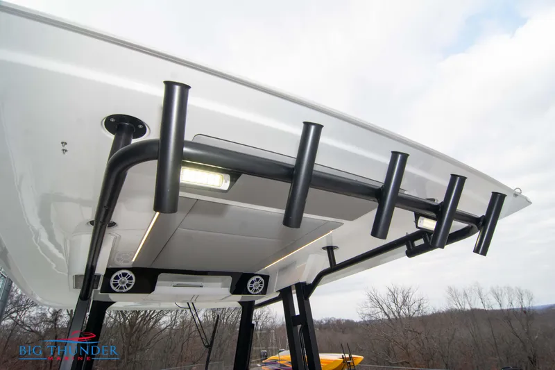  Yacht Photos Pics 2023 Jeanneau Leader 10.5 CC boat roof with rod holders and speakers.