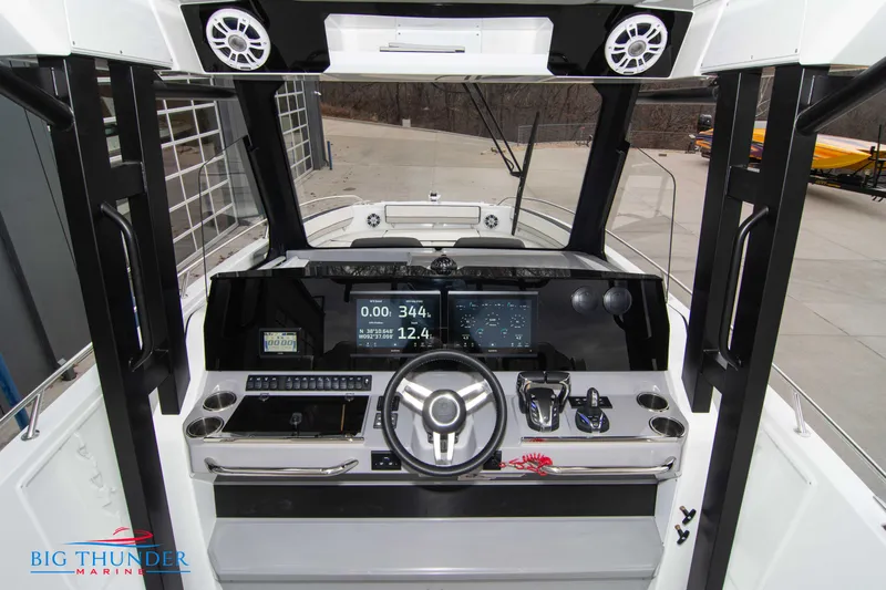  Yacht Photos Pics 2023 Jeanneau Leader 10.5 CC helm with modern controls and navigation display.