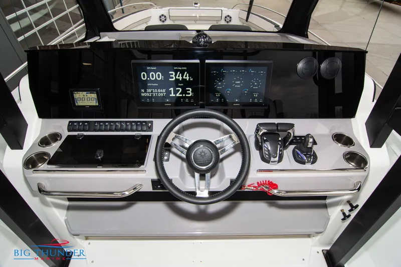  Yacht Photos Pics 2023 Jeanneau Leader 10.5 CC helm with modern controls and digital displays.