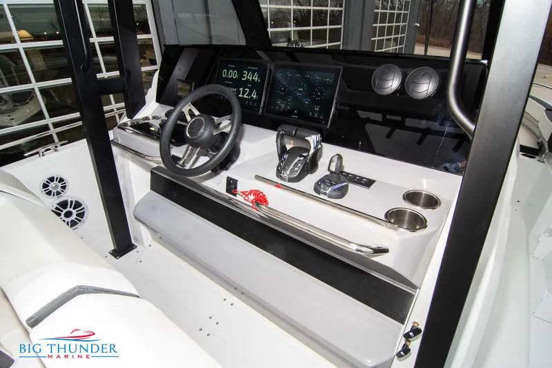  Yacht Photos Pics 2023 Jeanneau Leader 10.5 CC helm with modern controls and navigation displays.