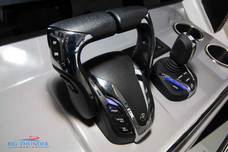  Yacht Photos Pics Close-up of 2023 Jeanneau Leader 10.5 CC boat controls and throttle.