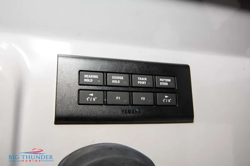  Yacht Photos Pics Control panel on 2023 Jeanneau Leader 10.5 CC boat with navigation buttons.
