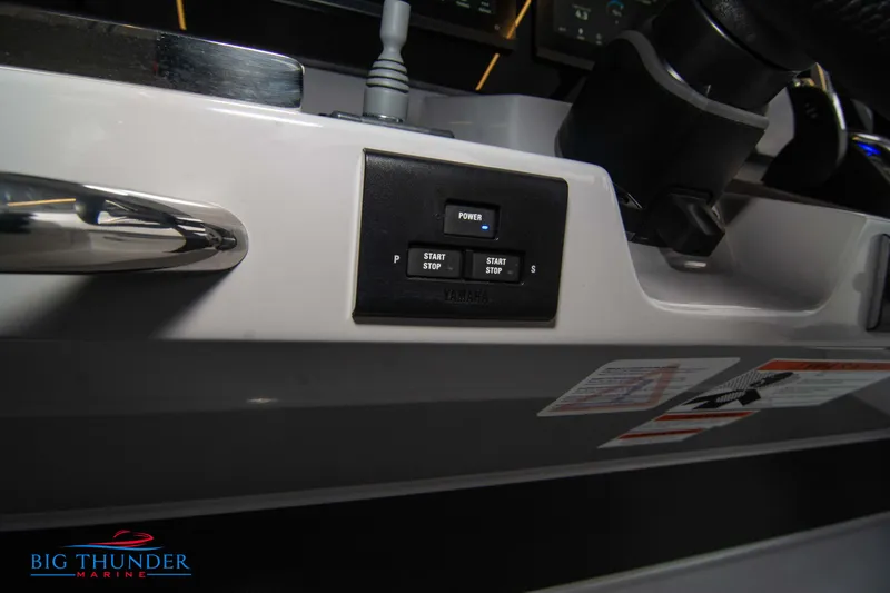  Yacht Photos Pics Control panel of 2023 Jeanneau Leader 10.5 CC boat with start/stop buttons.