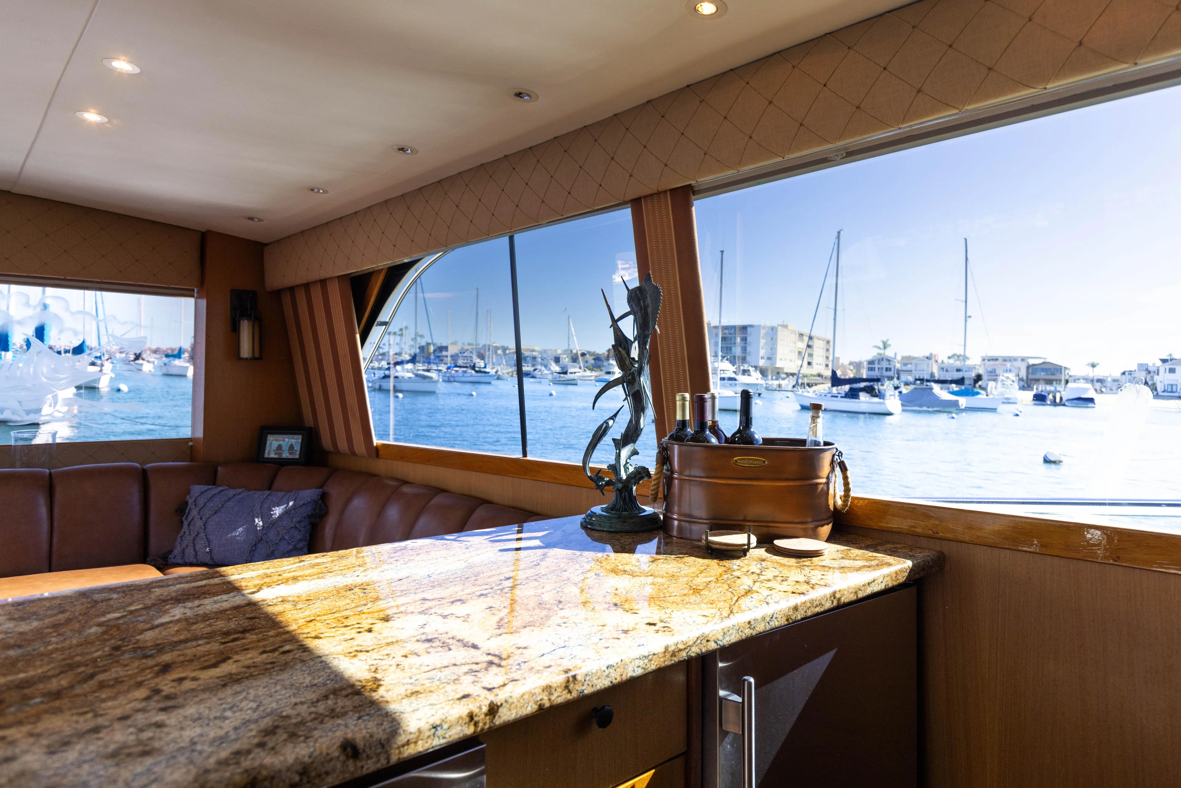 Lucky Marlin Yacht Photos Pics Interior of 1987 Ocean Yachts Convertible with marina view through large windows.