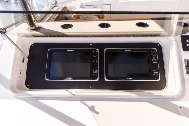 Lucky Marlin Yacht Photos Pics 1987 Ocean Yachts Convertible dashboard with dual navigation screens.