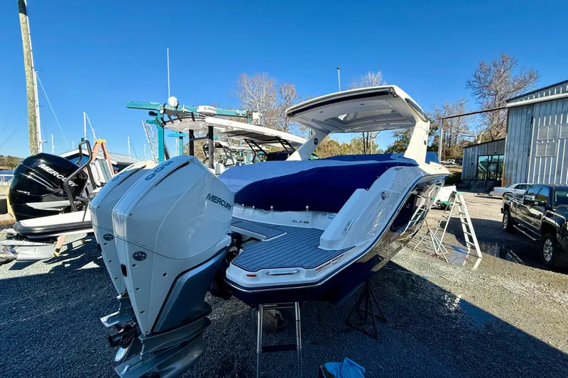  Yacht Photos Pics 2021 Sea Ray SLX 310 Outboard boat with dual Mercury engines, docked outdoors.