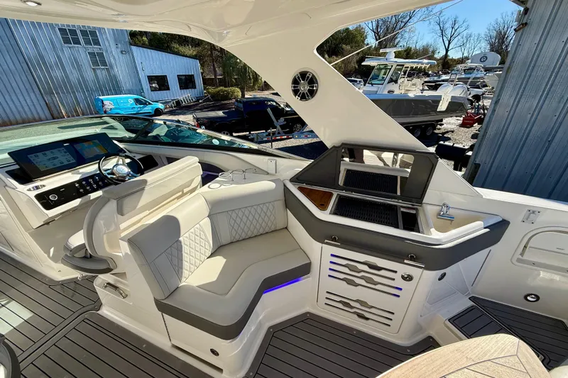  Yacht Photos Pics 2021 Sea Ray SLX 310 Outboard boat interior with helm, seating, and grill station.