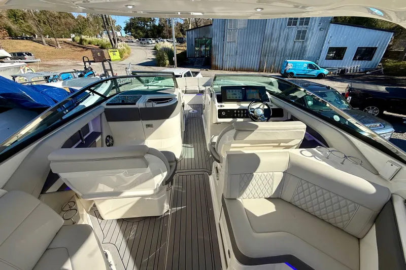  Yacht Photos Pics 2021 Sea Ray SLX 310 Outboard interior with luxurious seating and modern dashboard.