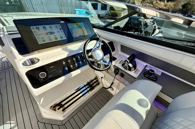  Yacht Photos Pics 2021 Sea Ray SLX 310 Outboard helm with modern controls and navigation display.