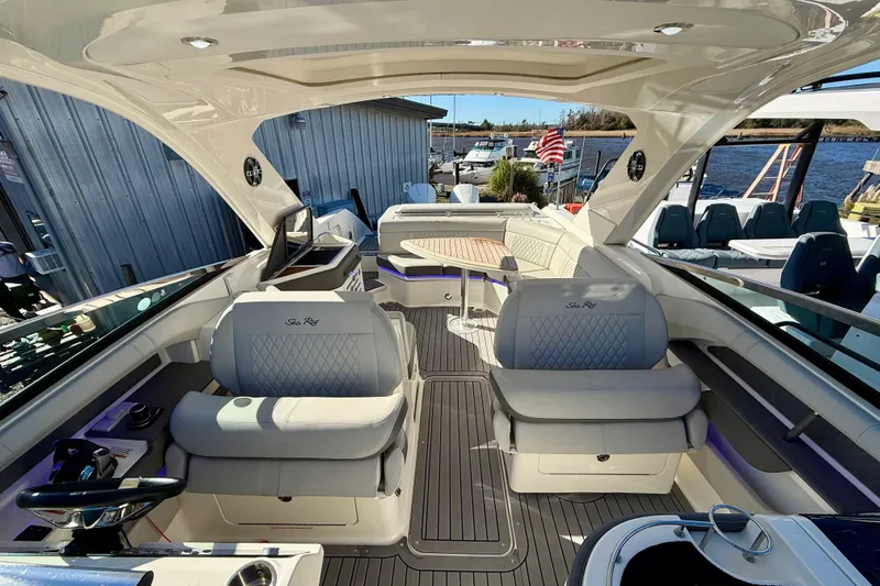  Yacht Photos Pics 2021 Sea Ray SLX 310 Outboard boat interior with luxurious seating and modern design.