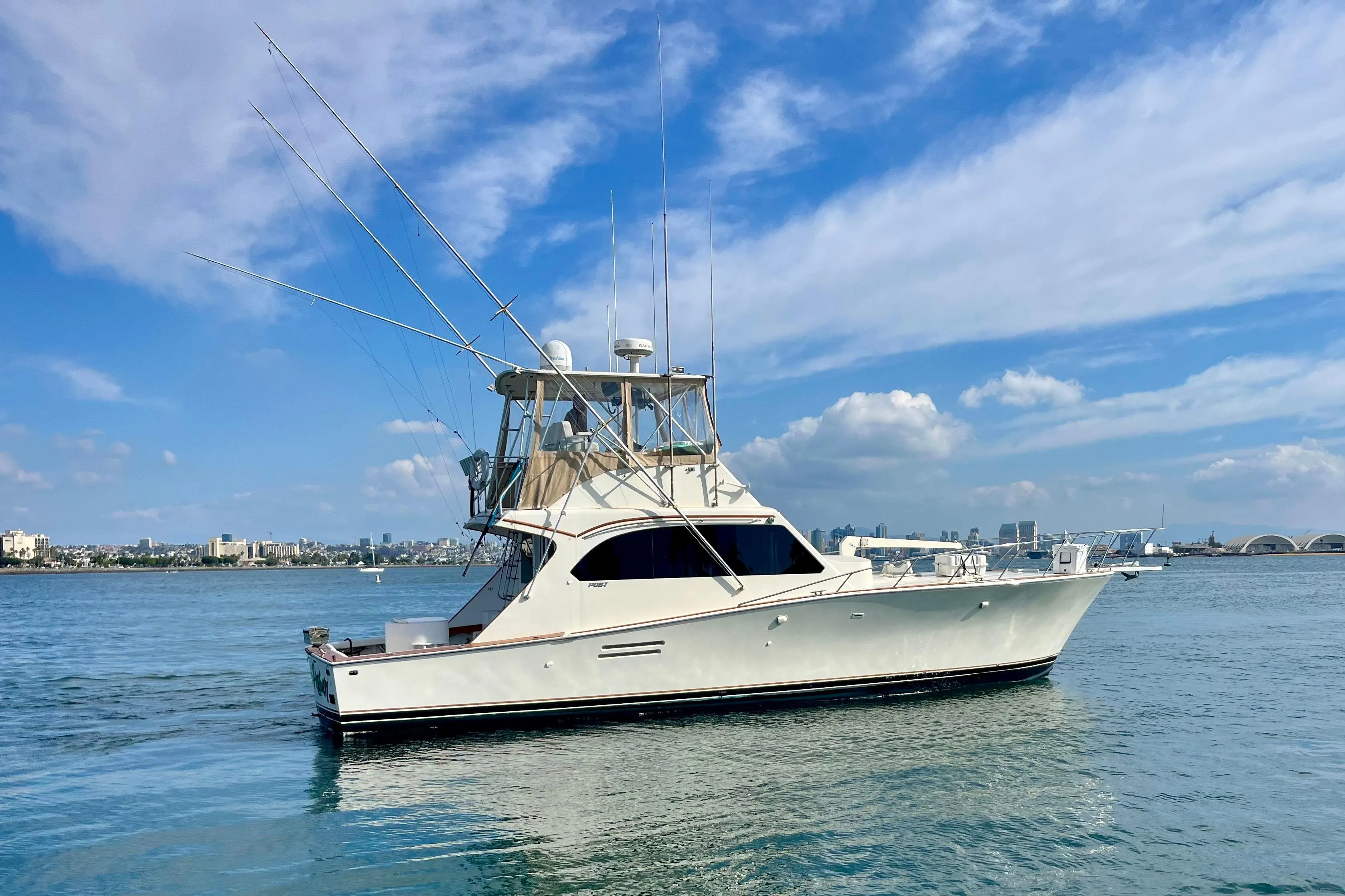 1988 Post 46 Sportfish yacht on calm water under a blue sky.