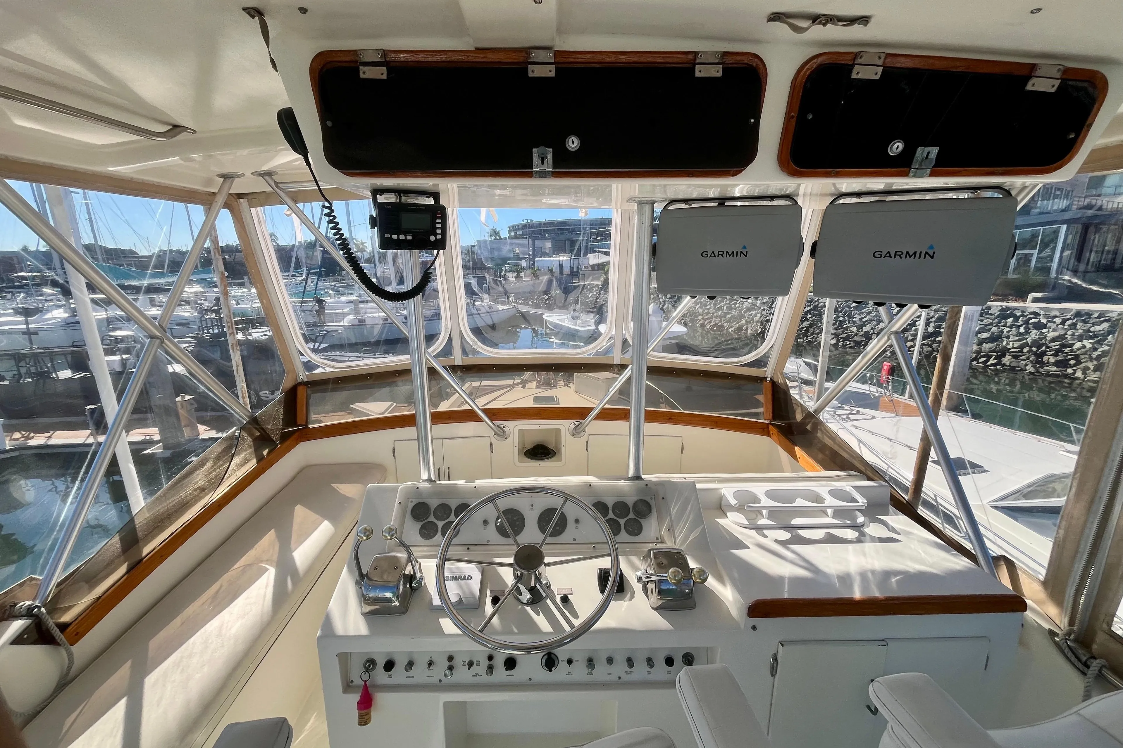 1988 Post 46 Sportfish boat cockpit with Garmin navigation, docked at marina.