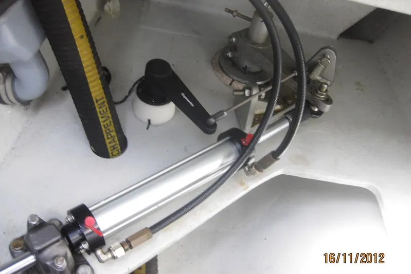 Delphine Yacht Photos Pics Hydraulic steering system of 2003 Outremer 45 catamaran, featuring hoses and components.