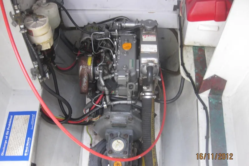 Delphine Yacht Photos Pics Engine compartment of a 2003 Outremer 45 catamaran, showing detailed mechanical components.