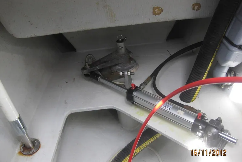 Delphine Yacht Photos Pics Outremer 45 (2003) boat interior showing hydraulic system components and hoses.