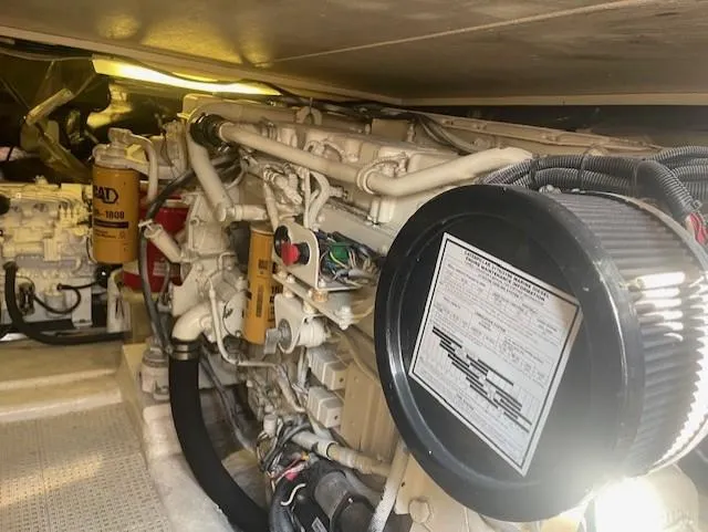 All Hans In Yacht Photos Pics Engine compartment of a 1999 Riviera SF boat, showcasing detailed mechanical components.