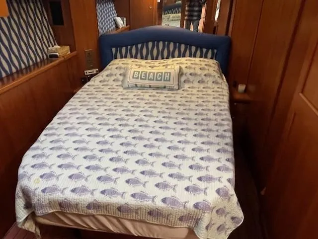 All Hans In Yacht Photos Pics Cozy bedroom in 1999 Riviera SF with fish-patterned bedding and "Beach" pillow.