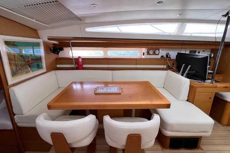Saba Yacht Photos Pics Luxurious interior of 2013 Jeanneau 57 yacht with elegant dining area and modern amenities.