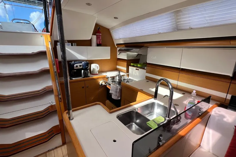 Saba Yacht Photos Pics Modern kitchen interior of 2013 Jeanneau 57 yacht with sleek cabinetry and appliances.