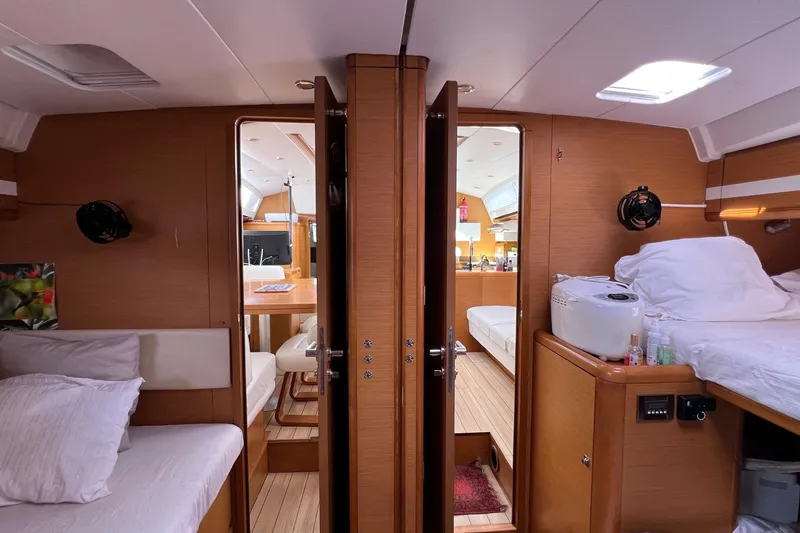 Saba Yacht Photos Pics Interior of 2013 Jeanneau 57 yacht, featuring cozy cabins and modern amenities.