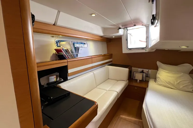 Saba Yacht Photos Pics Interior of 2013 Jeanneau 57 yacht with cozy seating and modern design.