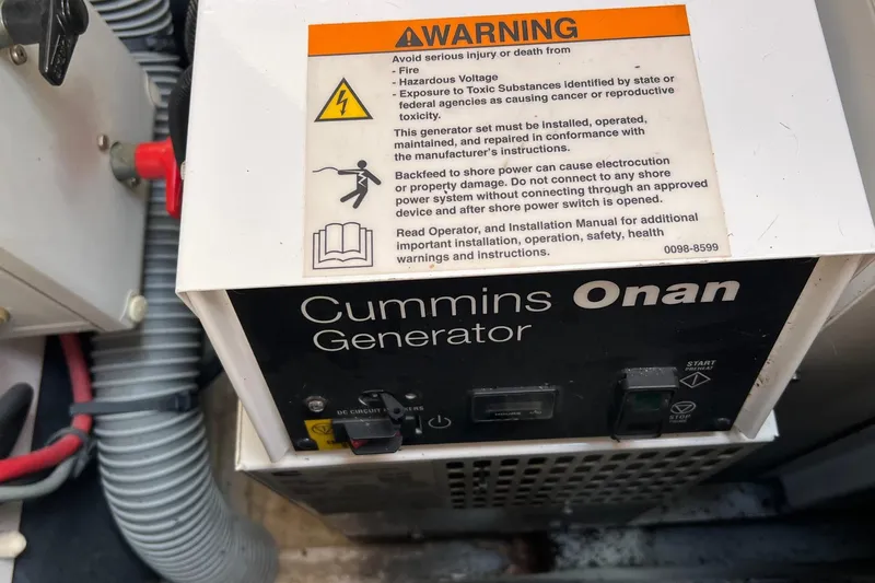 Saba Yacht Photos Pics Cummins Onan generator with warning label on a 2013 Jeanneau 57 yacht.