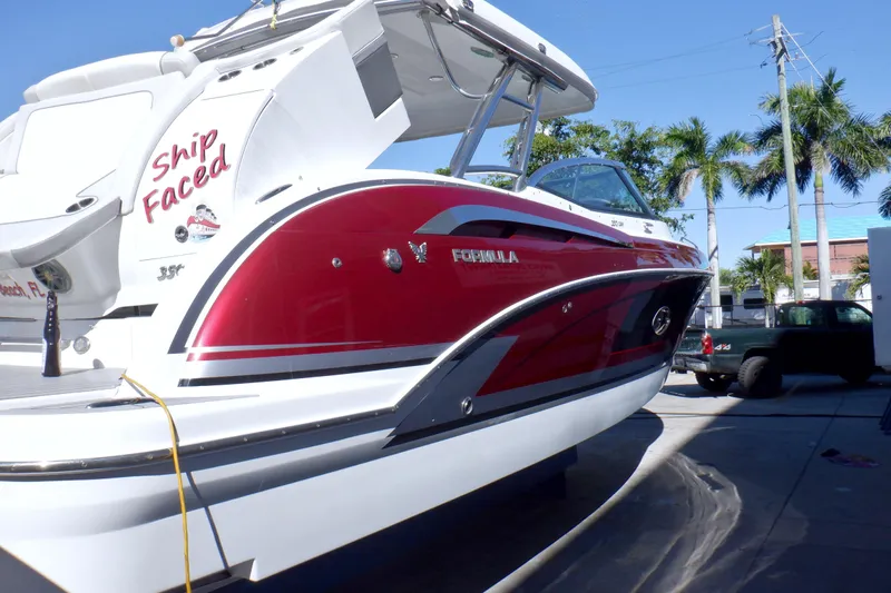 Ship Faced Yacht Photos Pics 2015 Formula 350 Crossover Bowrider boat with red and white design docked outdoors.