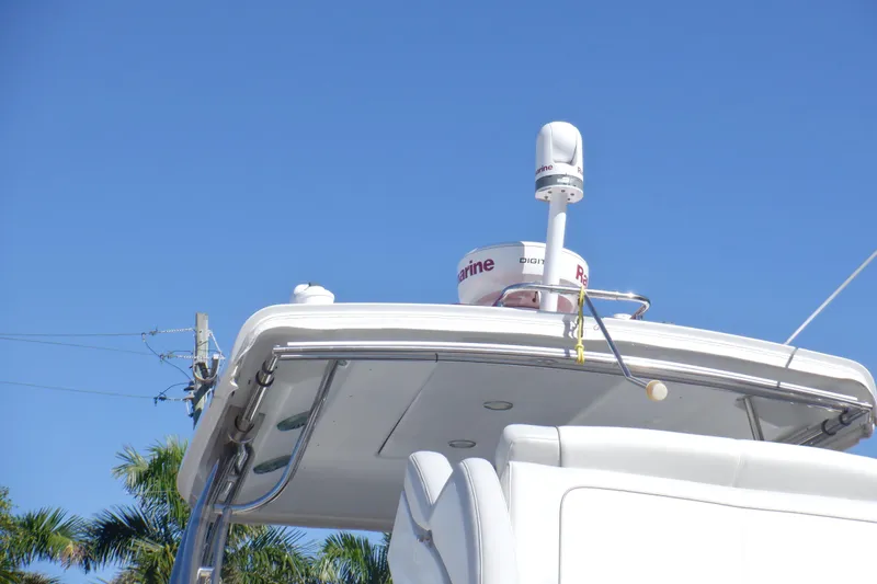 Ship Faced Yacht Photos Pics 2015 Formula 350 Crossover Bowrider boat with radar equipment against clear blue sky.