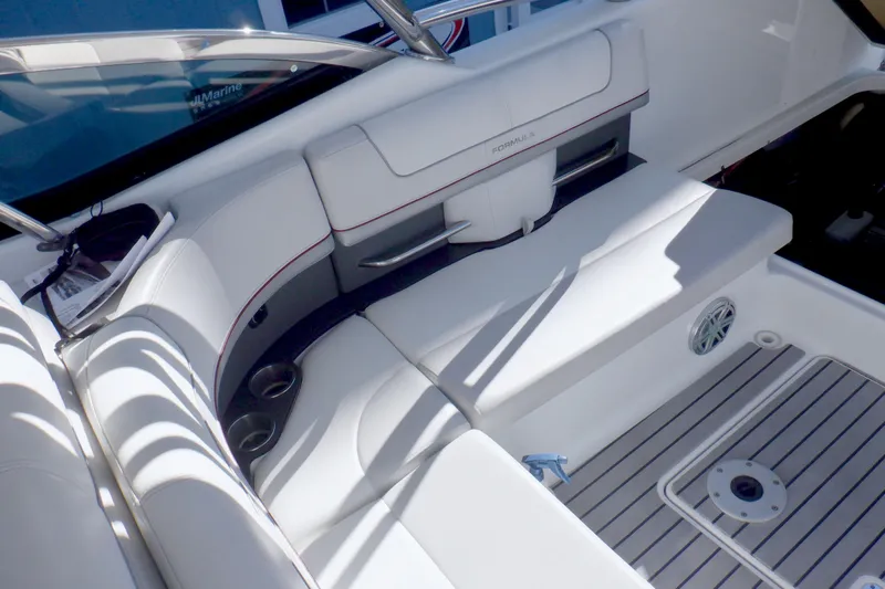Ship Faced Yacht Photos Pics 2015 Formula 350 Crossover Bowrider interior with white seating and cup holders.