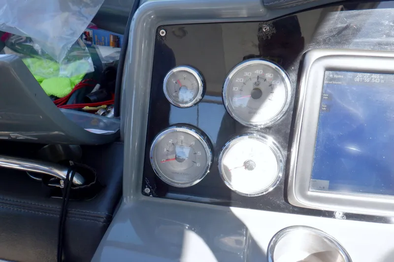 Ship Faced Yacht Photos Pics Dashboard of a 2015 Formula 350 Crossover Bowrider with gauges and navigation screen.