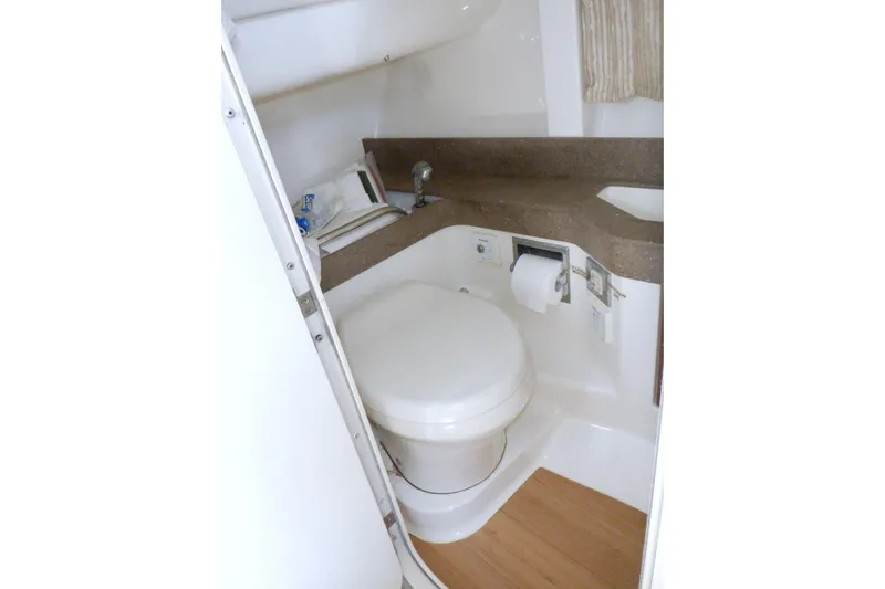Ship Faced Yacht Photos Pics 2015 Formula 350 Crossover Bowrider bathroom with compact design and modern amenities.