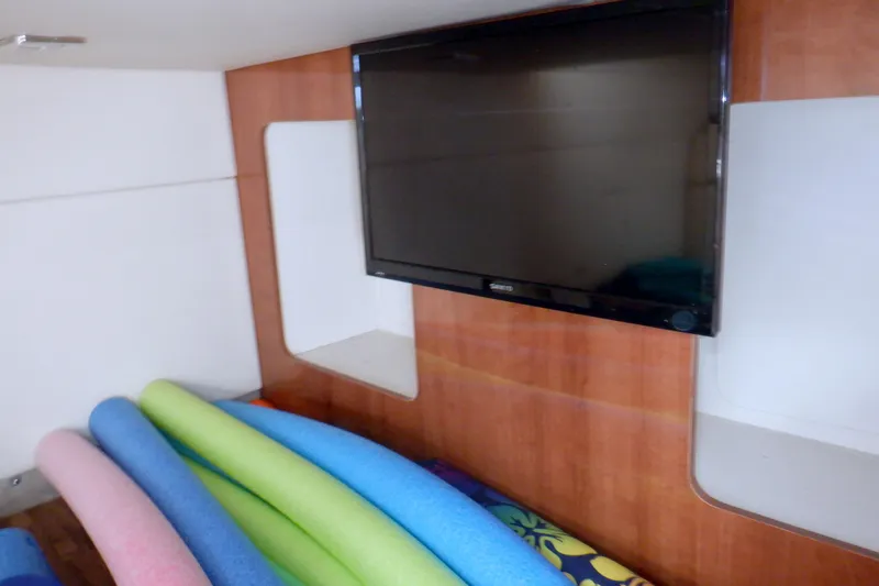Ship Faced Yacht Photos Pics Interior of 2015 Formula 350 Crossover Bowrider with TV and colorful pool noodles.