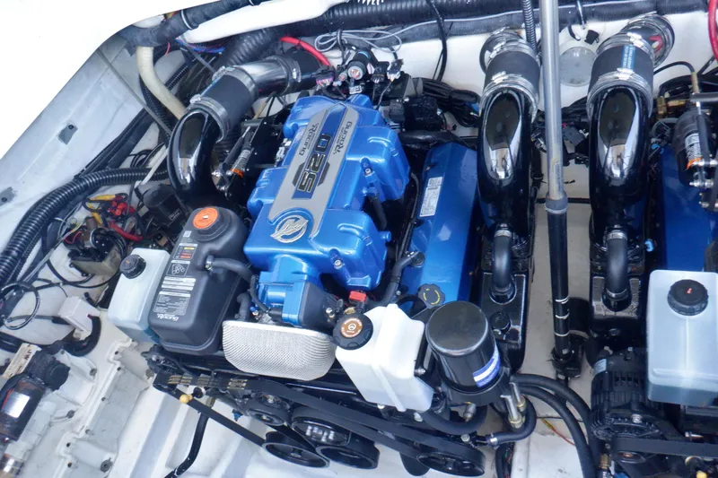 Ship Faced Yacht Photos Pics Engine compartment of a 2015 Formula 350 Crossover Bowrider with dual blue engines.