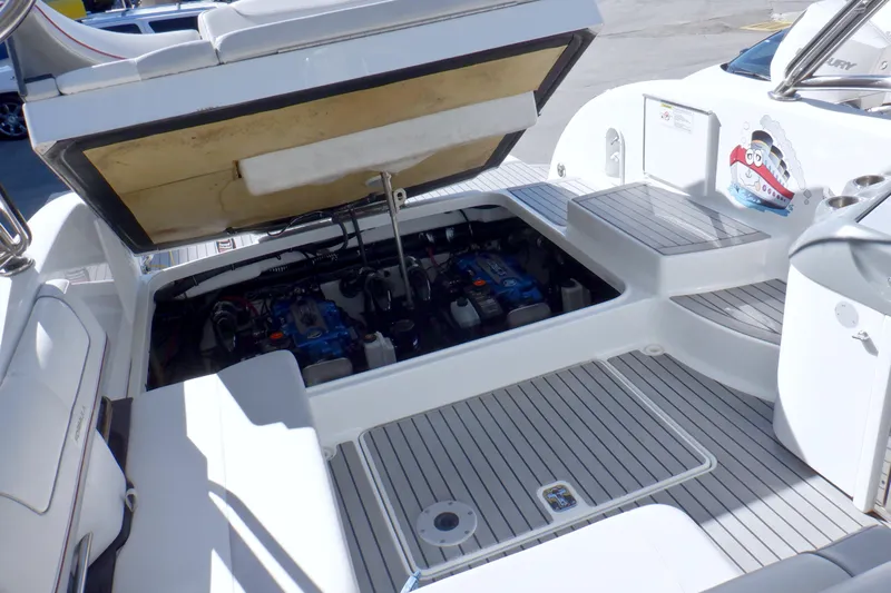 Ship Faced Yacht Photos Pics 2015 Formula 350 Crossover Bowrider engine compartment with open hatch, showcasing dual engines.