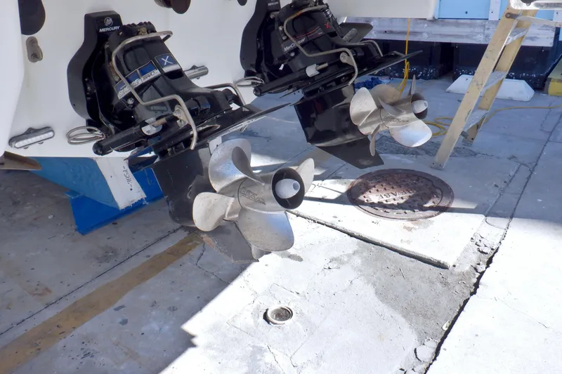 Ship Faced Yacht Photos Pics 2015 Formula 350 Crossover Bowrider boat propellers and outdrives in maintenance area.