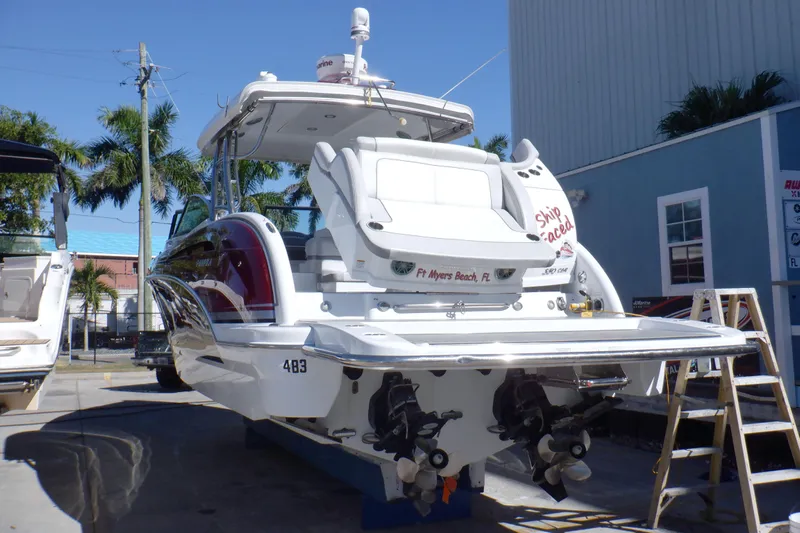 Ship Faced Yacht Photos Pics 2015 Formula 350 Crossover Bowrider boat docked, rear view, sunny day, palm trees.