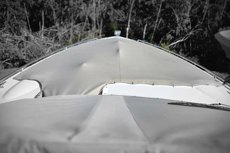 Ship Faced Yacht Photos Pics 2015 Formula 350 Crossover Bowrider with covered bow, surrounded by trees.